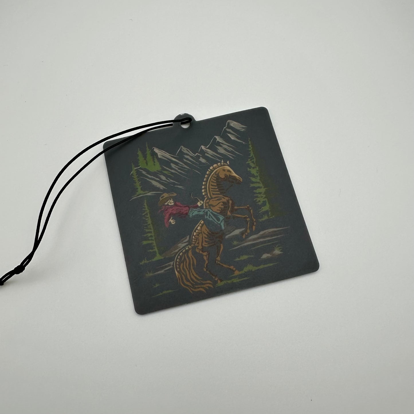 Cowboy skeleton mountain rodeo car air freshener | western car air freshener