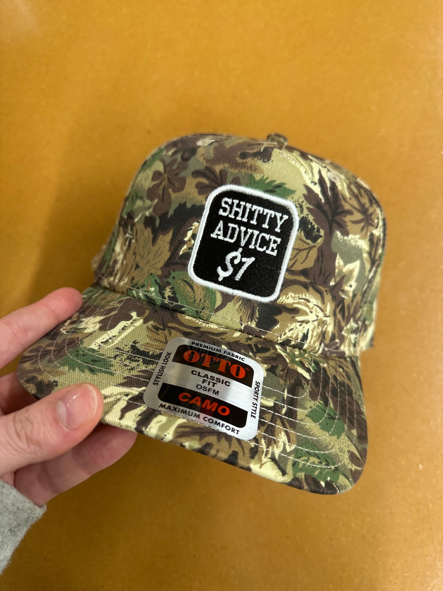 Shitty Advice $1 Embroidered Dad Hat – Otto Cap in Green, Camo & Navy