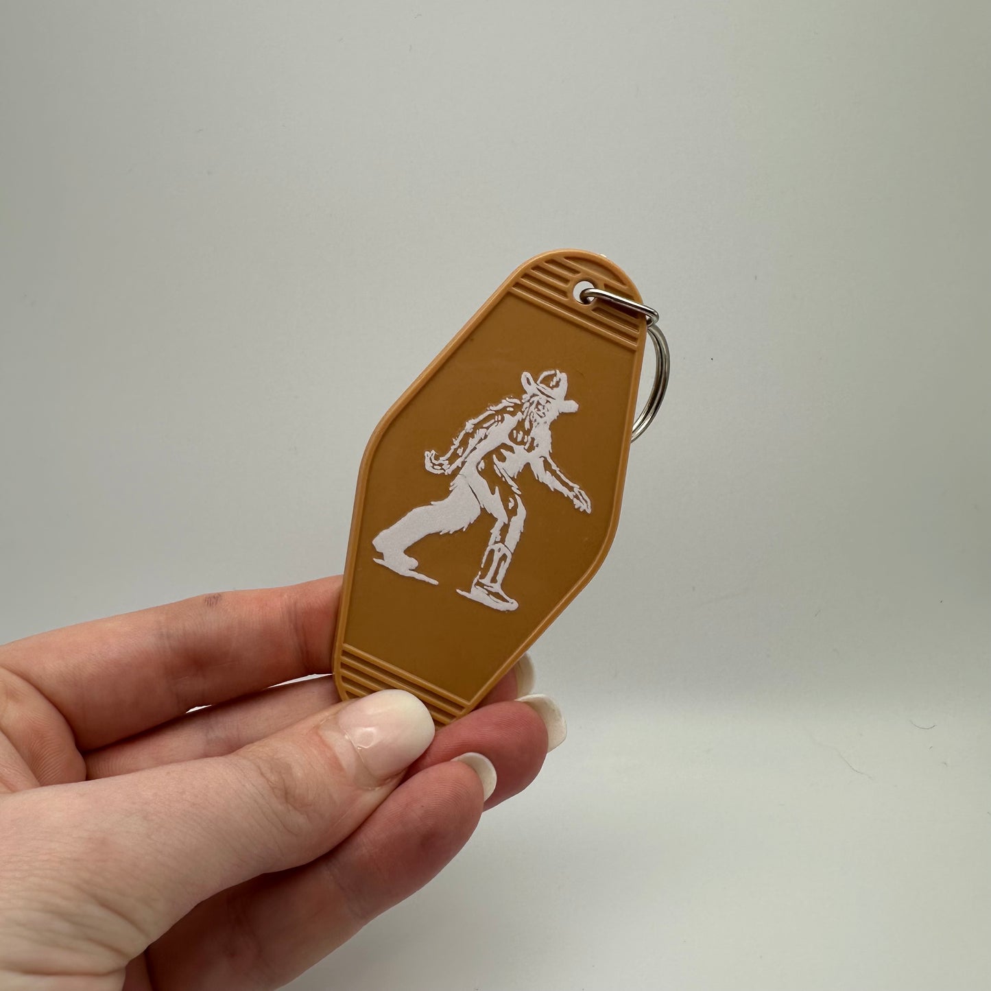 Cowboy Bigfoot motel keychain | western keychain