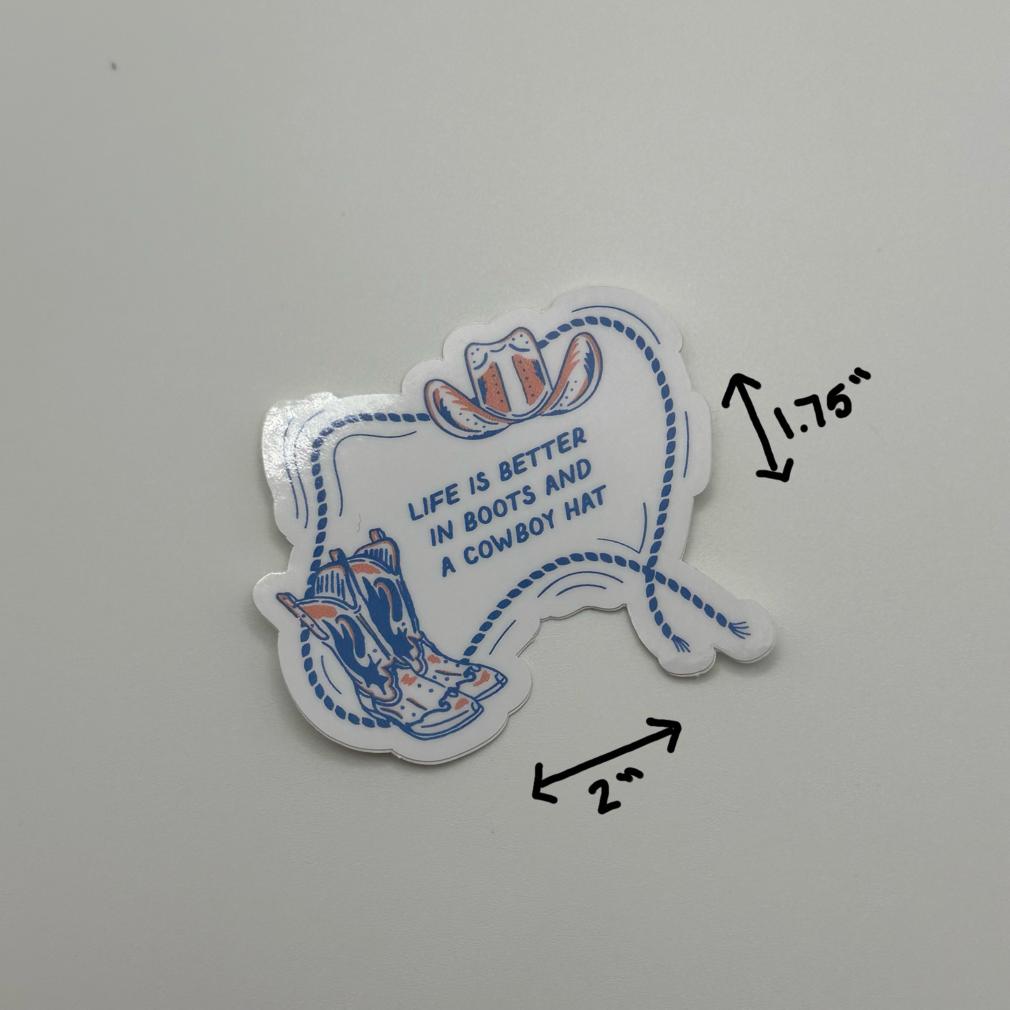 Life’s better in boots and a hat sticker