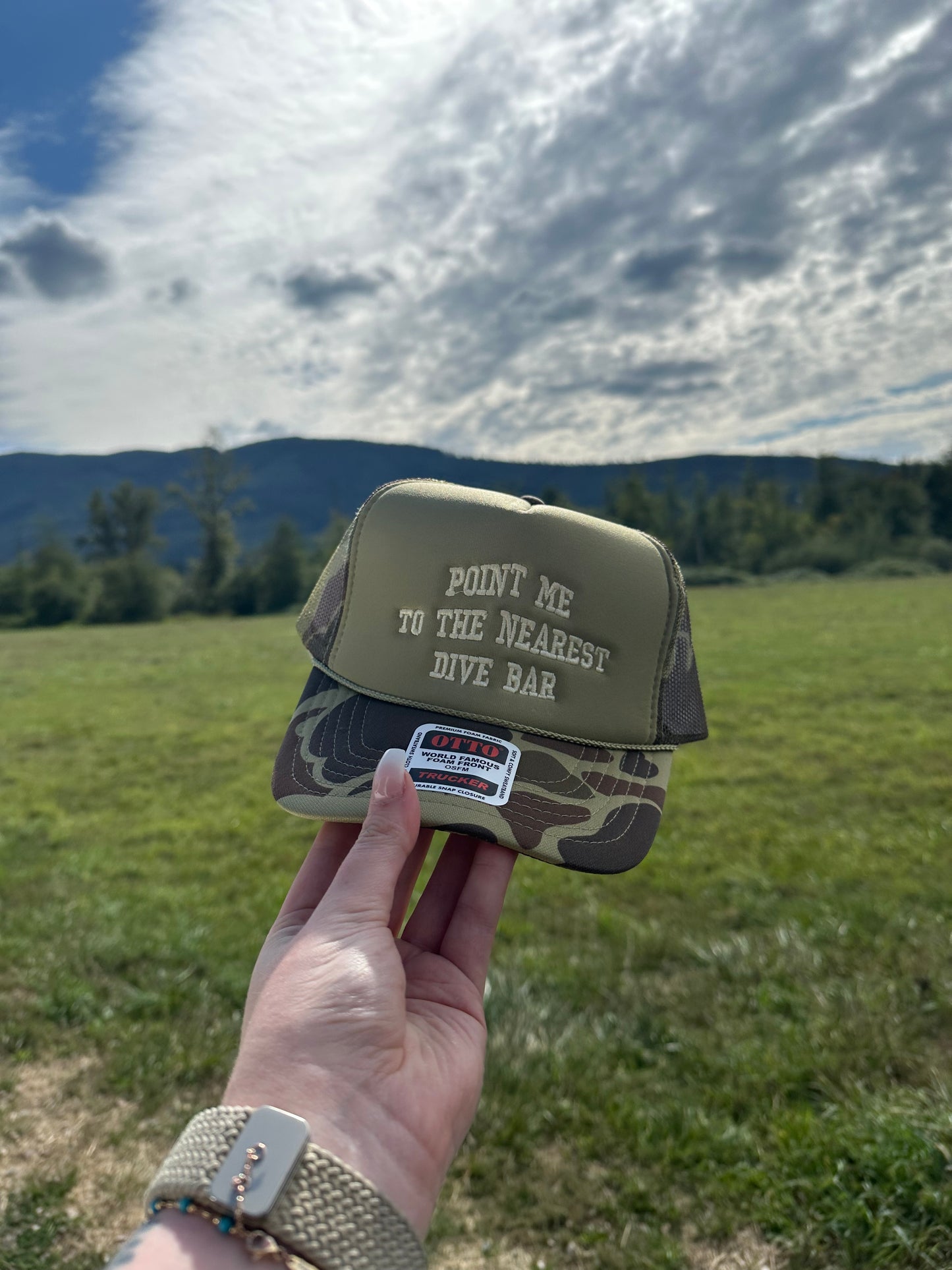 Point Me to the Nearest Dive Bar Embroidered Trucker Hat – Camo Otto Cap