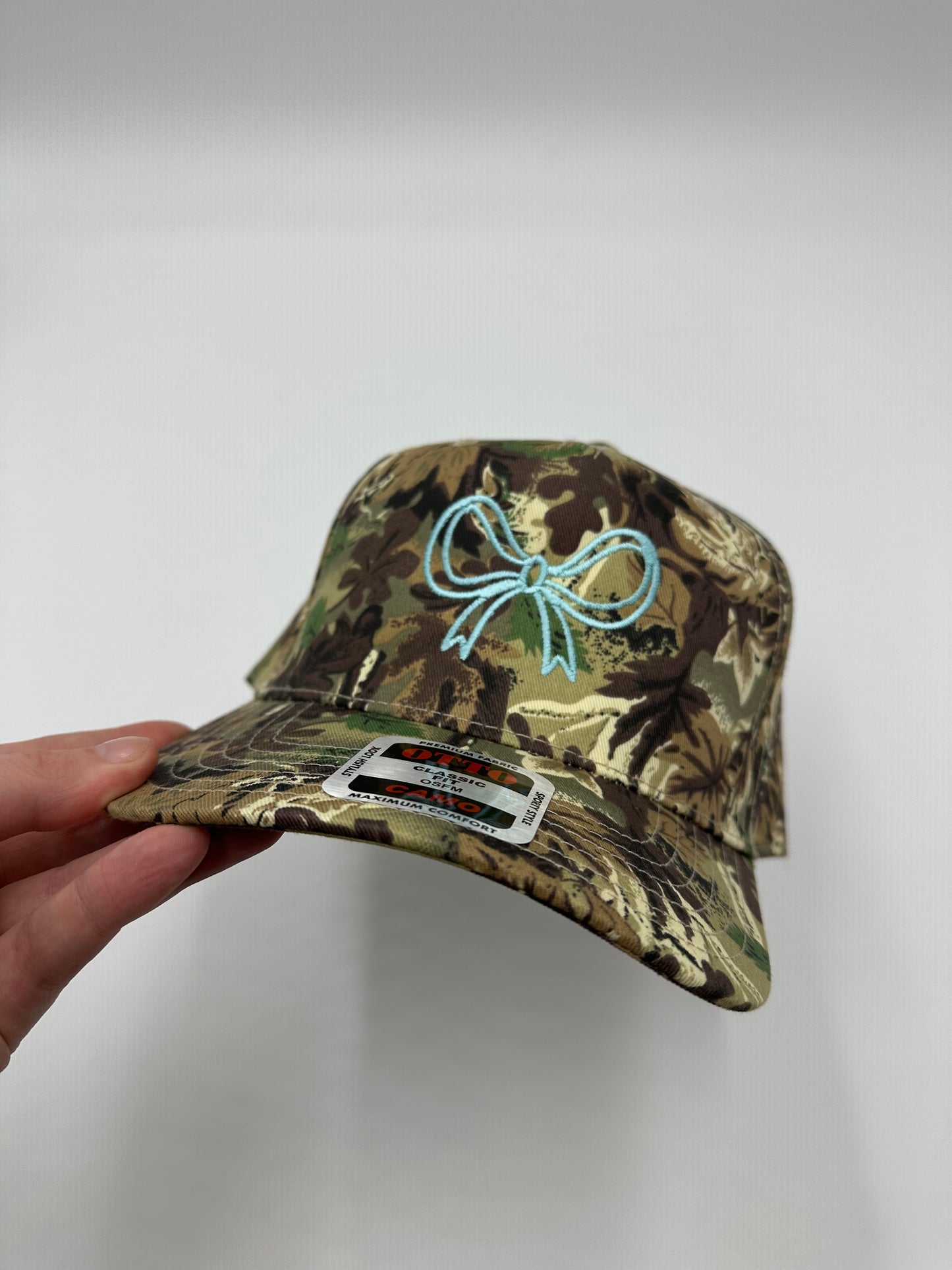 Turquoise bow embroidered trucker hat!
